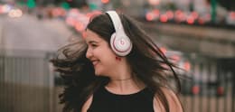 girl listening to music on beats headphones