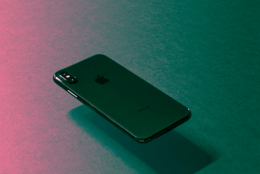 Floating iPhone X with purple and black background