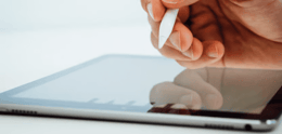 iPad with Apple Pencil in hand