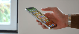 Side view of the iPhone 14 held in hand