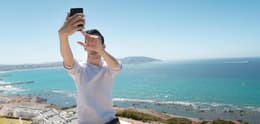 man taking selfie with iphone