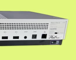 The back panel of the Xbox One S with the warranty sticker highlighted