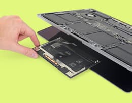 Image of trackpad area of opened MacBook Pro