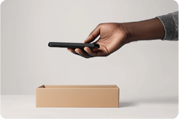 image of mobile being placed in a box