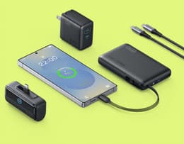 The Samsung Galaxy S26 is charging via a wired charger, with charging in progress.