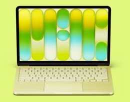 An open MacBook Neo with the screen on, showing the display and keyboard layout. 