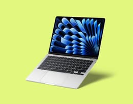 Apple MacBook Air 13-inch M3 (2024) on a desk with a modern workspace setup.