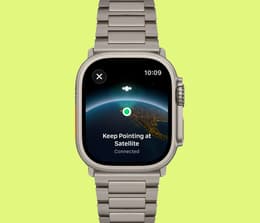 Apple Watch Ultra 3 in titanium finish with the display showing satellite SOS feature.