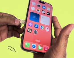 SIM card being inserted into an iPhone.
