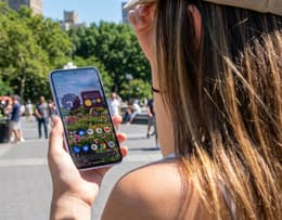 Front view of the Google Pixel 10a showing its bright 6.3-inch Actua display in outdoor sunlight.