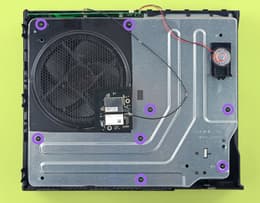Xbox One internal chassis with the eight black screws highlighted
