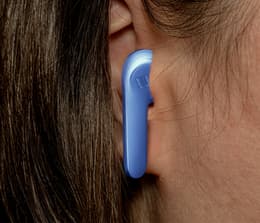 Close-up of JBL Vibe 200TWS earphones in a person's ear.