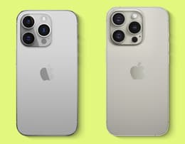An iPhone 14 Pro Max and iPhone 15 Pro Max compared in hand. 