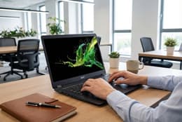 Image of an office worker using an Acer Aspire 5 laptop