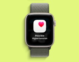 An Apple Watch 11 watch face displaying a possible hypertension alert. 